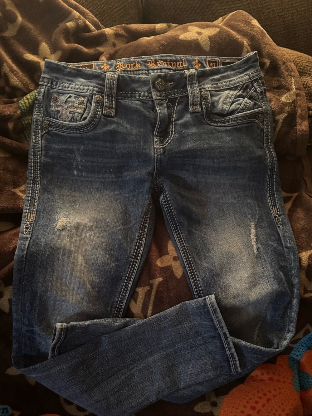 Rock Revival Women's Faded Blue Skinny Jeans with Subtle Distressing